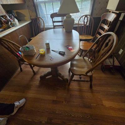 Wooden Dining Table Set with Six Chairs
•	A classic wooden dining table set complete with six matching chairs, perfect for family...