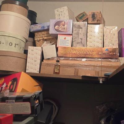 Assorted Games and Collectibles (Scrabble, Dolls, and More)
- This collection includes various boxed games and toys, including Scrabble,...
