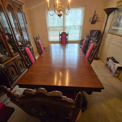 Antique Dining Table Set with Six Carved Chairs
- This elegant antique dining table set features a beautifully crafted wood table with...