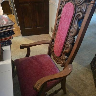 High-Backed Wooden Chair
- This antique high-backed wooden chair is a statement of classic elegance. With intricate carvings and rich...