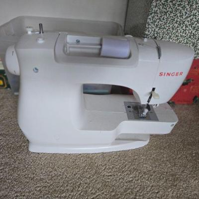 Singer Sewing Machine
- A portable, compact Singer sewing machine, perfect for everyday use or hobby sewing. The machine features...