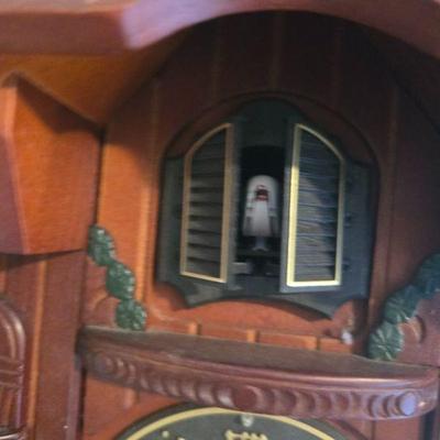Vintage Cuckoo Clock
-  This beautifully carved wooden cuckoo clock features a detailed forest design with pine trees and wildlife. The...