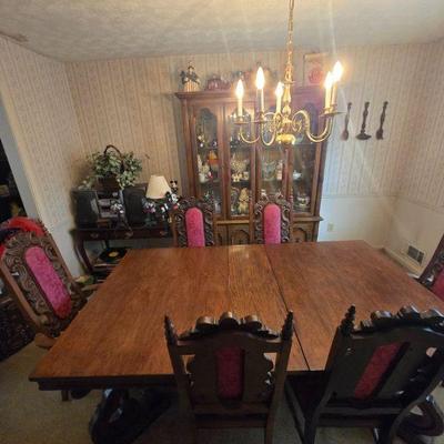 Antique Dining Table Set with Six Carved Chairs
- This elegant antique dining table set features a beautifully crafted wood table with...