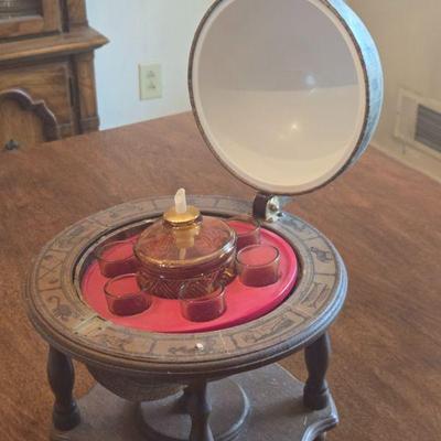 Vintage Glass Globe and Shot Glass Stand
- This vintage glass globe doubles as a drink holder and is a statement piece for any home bar....