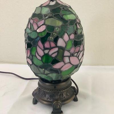 JAKA813 Tiffany Style Stained Glass Egg Lamp	Lamp has a lily pad design. Tested and confirmed to work. Measures approximately 12"...
