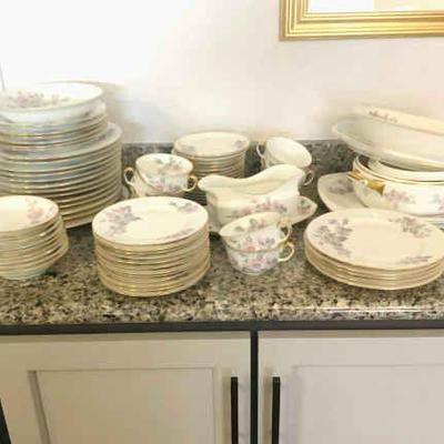 JAKA836 Epiaq Porcelain Set	Chzechoslovakian porcelain plates in a rose design with gold trim, manufactured between 1918 and 1920....