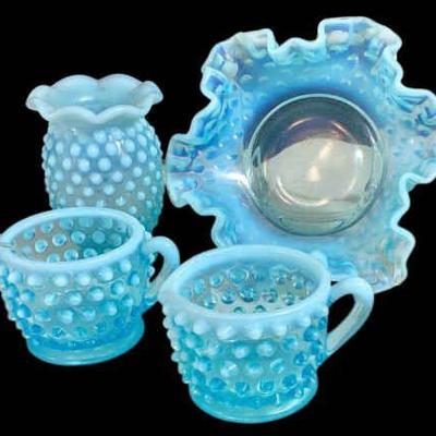 JAKA764 Fenton Blue Opalescent Hobnail Glass Collection	sugar bowl, creamer bowl, vase, and candy bowl
