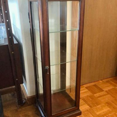 JAKA807 Short and Slim Curio Cabinet	Wooden curio cabinet is great for small and tight spaces. It has glass walls and shelves. Cabinet...