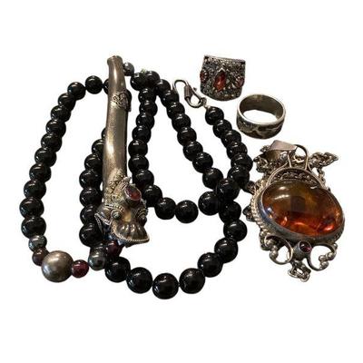 JAKA604 Vintage Asian Jewelry Assortment Sterling Pieces	This lot includes a sterling and stone Chinese style dragon and black bead...