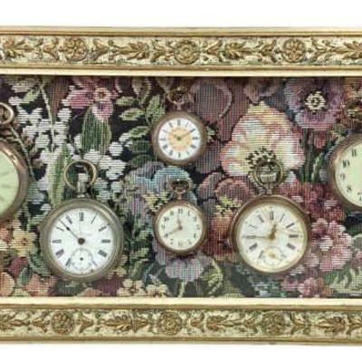 JAKA723 Vintage German/French Pocket Watches Mounted in a Shadow Box	Six watches with a fabric background. Four of them open to reveal...