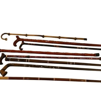 JAKA803 Cane And Walking Stick Collection #5	Assortment of canes and walking sticks. Notable includes are a handmade hardwood bird head...