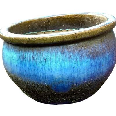 JAKA653 Ombré Turqoise, Brown And Blue Large Planter	This planter has two drainage holes and some textured glazed spots inside. 
