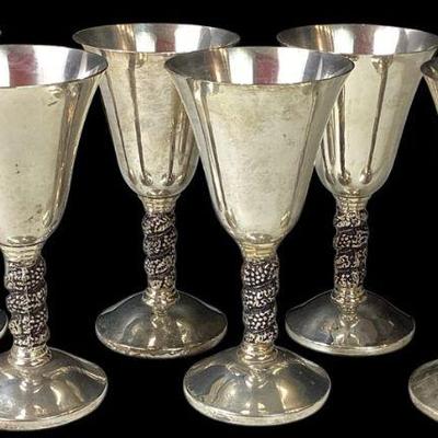 JAKA733 Ornate 1960’s Silver Plated Wine Goblets Made in Madrid, Spain, Lot 1	Detailed twisted grapevine stems around neck of goblet
