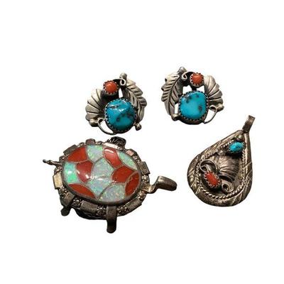 JAKA601 Navajo Handmade Pendants And More	This lot includes handmade Navajo sterling and stone pendent and earrings set by TT Thomas made...