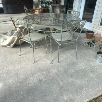 vintage wrought iron and glass table and 4 chairs with cover
