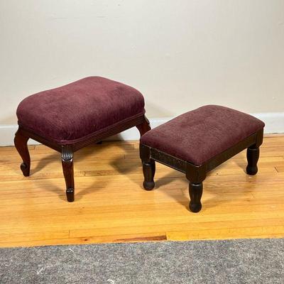 (2pc) Burgundy Upholstered Footstools | Vintage French-inspired carved leg footstools with burgundy upholstery.

