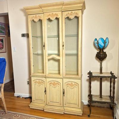 French Country Curio Cabinet | French Country style painted curio cabinet with plug-in light to illuminate items on display and three...