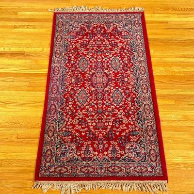 Persian/Sarouk Area Rug (Small) | Persian/Sarouk style area rug in red and navy with white fringe along two edges. - w. 27 x l. 56 in

