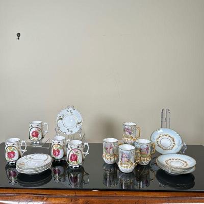 (16pc) Gold-Trimmed Demitasse Tea Sets | Two sets of gold-trimmed demitasse tea sets, including teacups/saucers. One set features red...