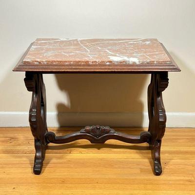 Italian Renaissance Marble Top Table | Italian Renaissance style pink marble top table with carved wooden legs, featuring hand-carved...