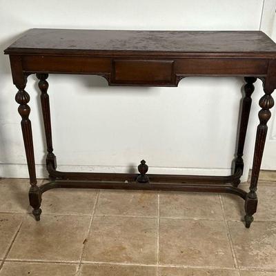 Dark Finished Wooden Console Table | Dark finished wooden console table with single drawer, turned legs, and finial details on bottom...