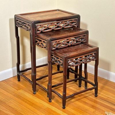 (3pc) Chinese Nesting Tables | Antique (1900s) Chinese hardwood nesting tables, with a carved front frieze on faux bamboo designed legs....