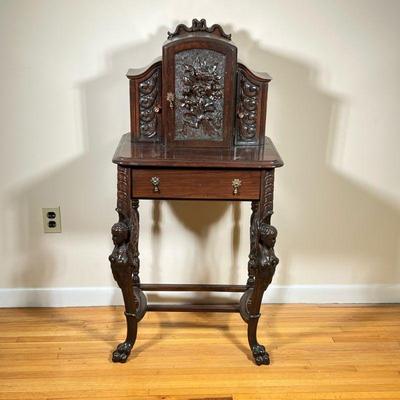Walnut Telephone Table | Antique (1920s) carved walnut telephone table with intricate floral carvings on the front panels and hand-carved...