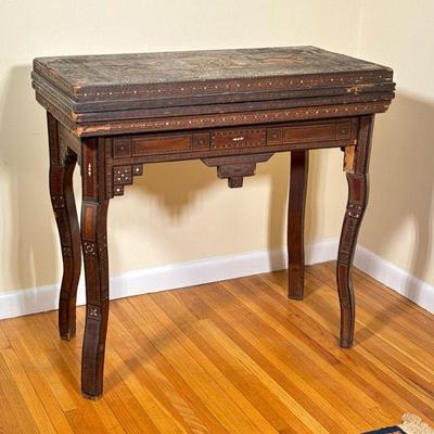 Islamic/Moorish Folding Game Table | Vintage (1950s) Islamic/Moorish style folding game table with parquetry and inlaid mother-of-pearl...