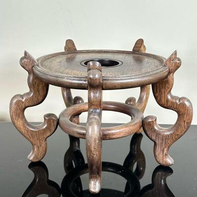 Chinese Rosewood Plant Stand | Vintage (1950s) Chinese rosewood pedestal plant stand with uniquely carved legs and a central opening for...