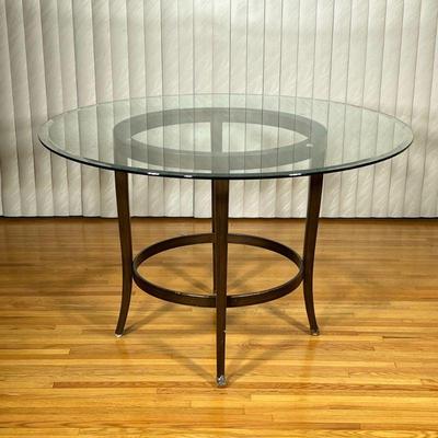 Round Glass Top Dining Table | Round glass top dining table on metal base with dark finish. - h. 30 x dia. 48 in

