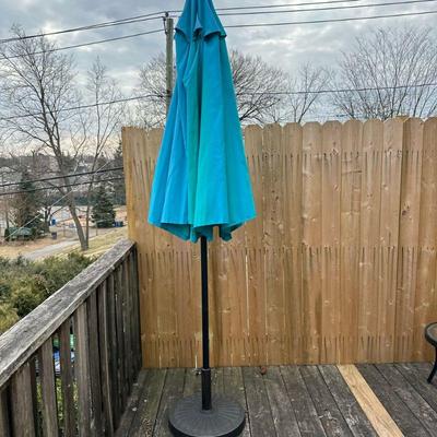 (2pc) Outdoor Umbrella & Stand | Outdoor umbrella on wrought iron stand with turn crank for opening the umbrella.

