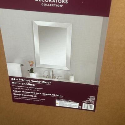 Two mirrors still in boxes
