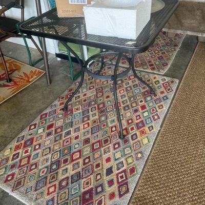 Wrought iron table ad cute rugs