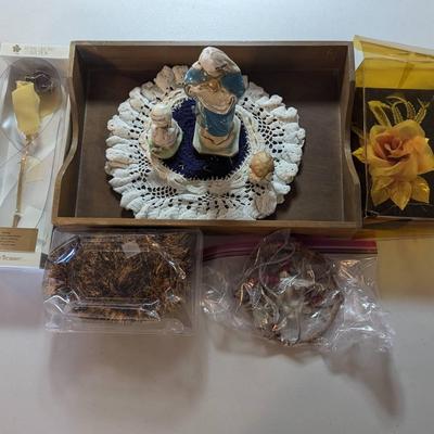PPE026-Assorted Figurines, lei, flowers and a wind chime