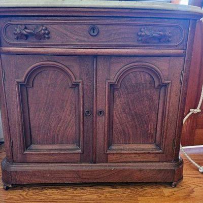 Small marble topped cabinet