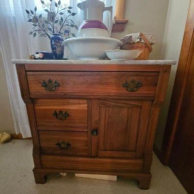 Marble-topped dry sink and ceramic pitcher and basin