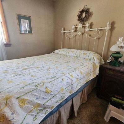 Antique wrought-iron bed and coverlet