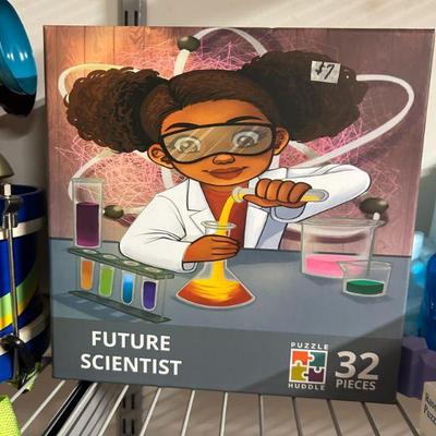 Puzzle – Future Scientist (32 Pieces)
- This 32-piece puzzle features an inspiring image of a young girl exploring science. It’s a fun...