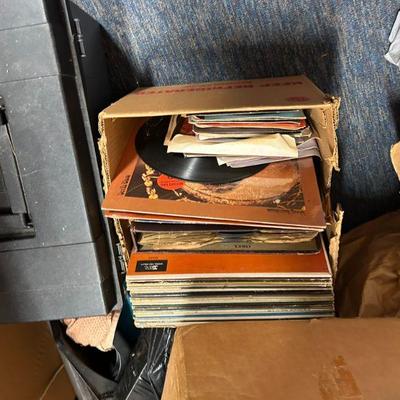Vintage Vinyl Records Collection
- A box filled with vintage vinyl records, featuring a variety of music from different eras. A great...