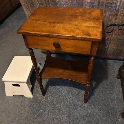 
Vintage Side Table
- A classic, small wooden side table with a drawer and shelf. Perfect for a bedside or accent piece in any room. The...