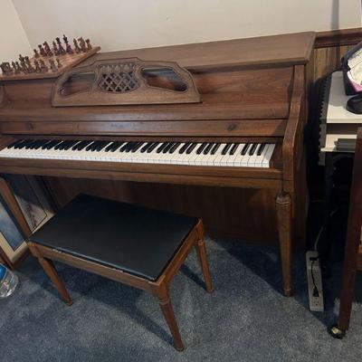 Piano with Bench
- A Yamaha upright piano, complete with a matching bench, perfect for music lovers or someone looking to start playing....