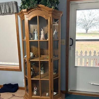 Glass Display Cabinet for Collectibles
- A stylish, oak corner glass display cabinet perfect for showcasing collectibles or fine china....