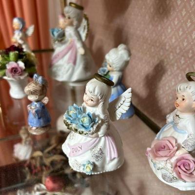Vintage Angel Figurines Collection
- A beautiful set of vintage angel figurines, including a special “July” angel with intricate floral...