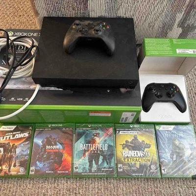 #11510 • Xbox One X, (2) Controllers, (5) Games, and Box
