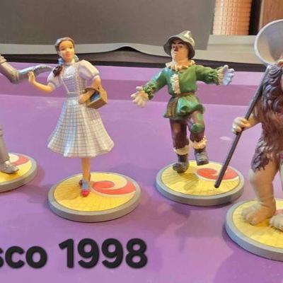 There are 2 sets of the 4 Enesco Wizard of Oz figures