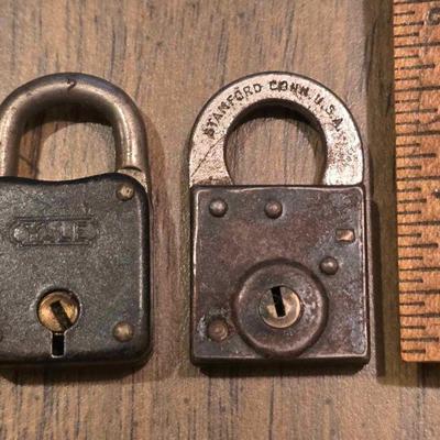 Several vintage and antique pad locks and keys