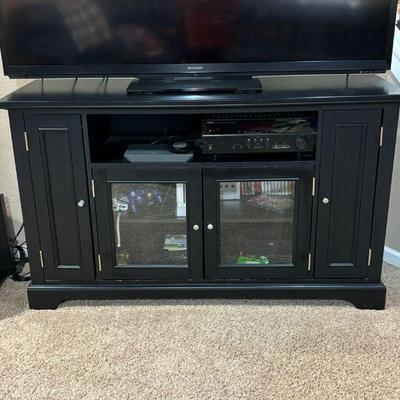 Lot #47 - Black TV Stand with Glass Doors and Storage