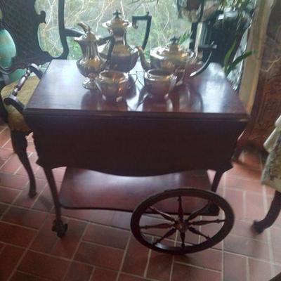 Antique mahogany ball and vlaw foot tea cart