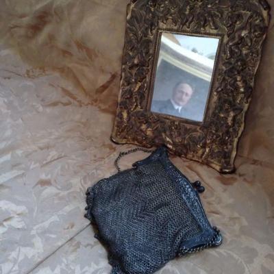 Gilded vanity mirror and silver purse