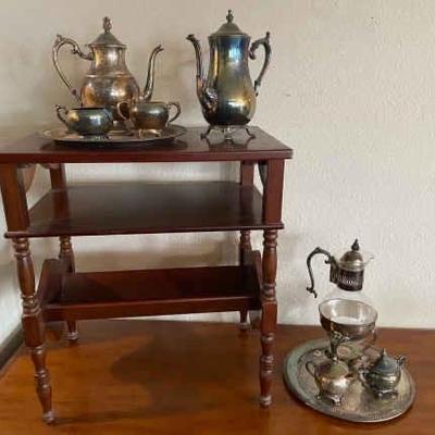 https://ctbids.com/estate-sale/34797/item/3906537/Plated-Silver-Serving-Set-And-Small-Wooden-Table
